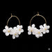 White floral earrings on 25mm golden steel hoops (1 pair)