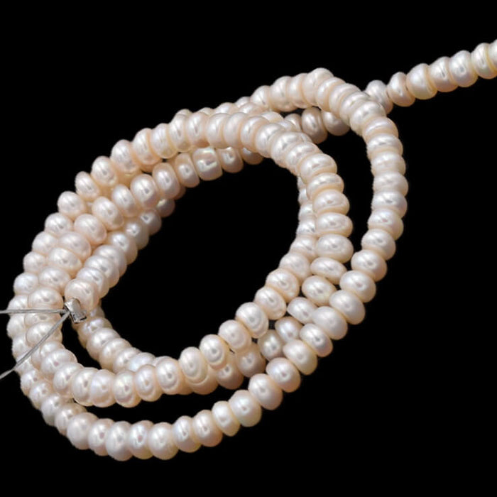 Freshwater pearl button rondelle white cream - 4x2mm - Hole: 0.5mm (1 Strand)