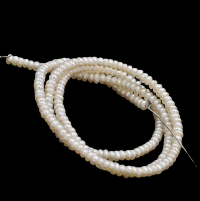 Freshwater pearl button rondelle white cream - 3x1.5mm - Hole: 0.5mm (1 Strand 38cm)