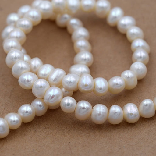 Buy White potatoe freshwater pearl 6-6.5mm (1 strand-40cm)